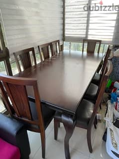 Dinning table and 8 chairs in good confition