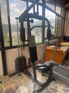 gym workout machine with bench and weights