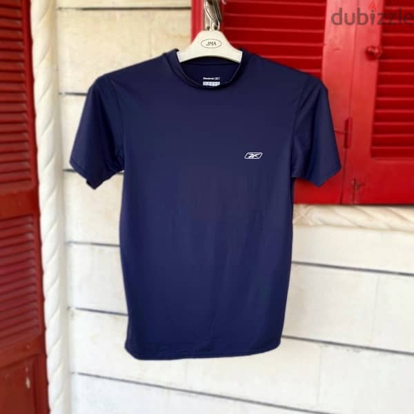 REEBOK Sports Slim Fit T-Shirt. 0