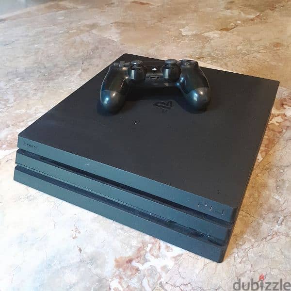 ps4 pro + 1 controller + 8 CDs 0