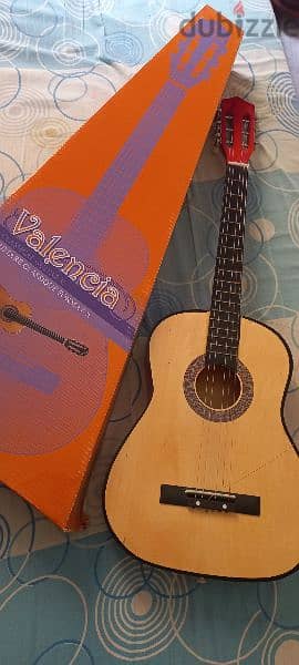 classical wooden guitar with it's box 0