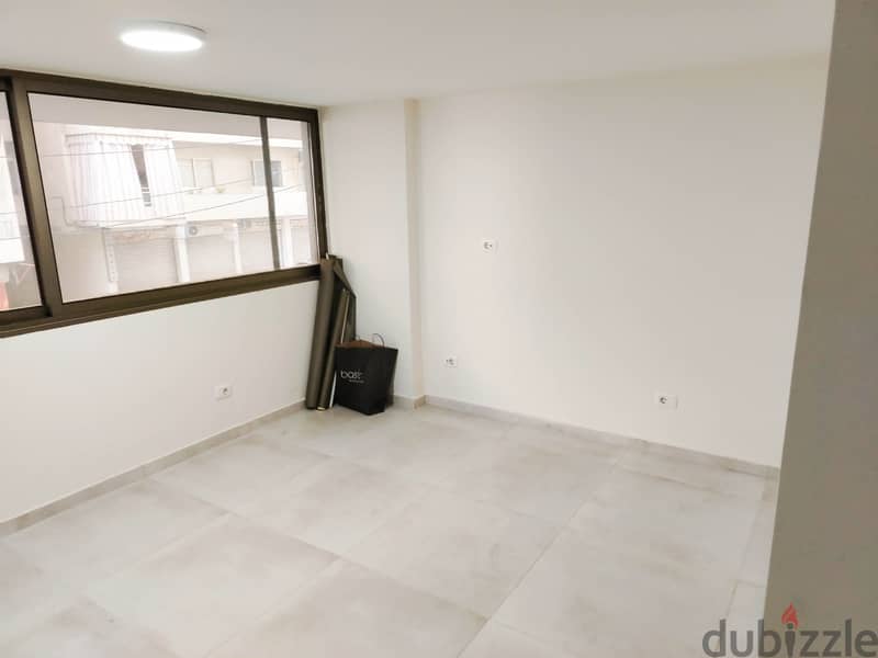 125 SQM Prime Location Shop in Dekwaneh, Metn 2