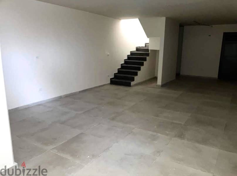 125 SQM Prime Location Shop in Dekwaneh, Metn 4