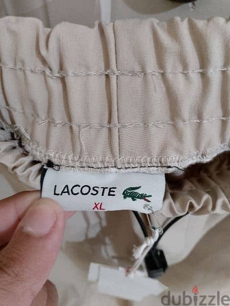 بنطلون رجالي قماش بعدو جديد ماركة LACOSTE قياس XL السعر 15$ 6