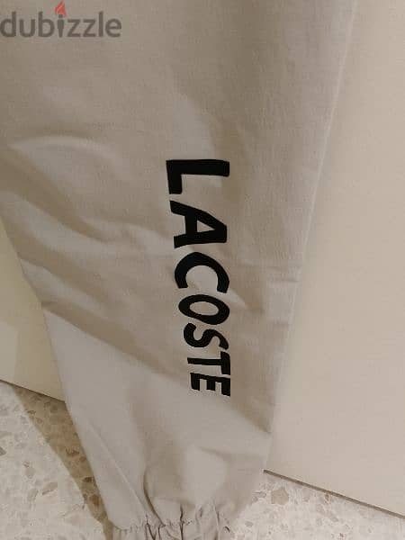 بنطلون رجالي قماش بعدو جديد ماركة LACOSTE قياس XL السعر 15$ 9