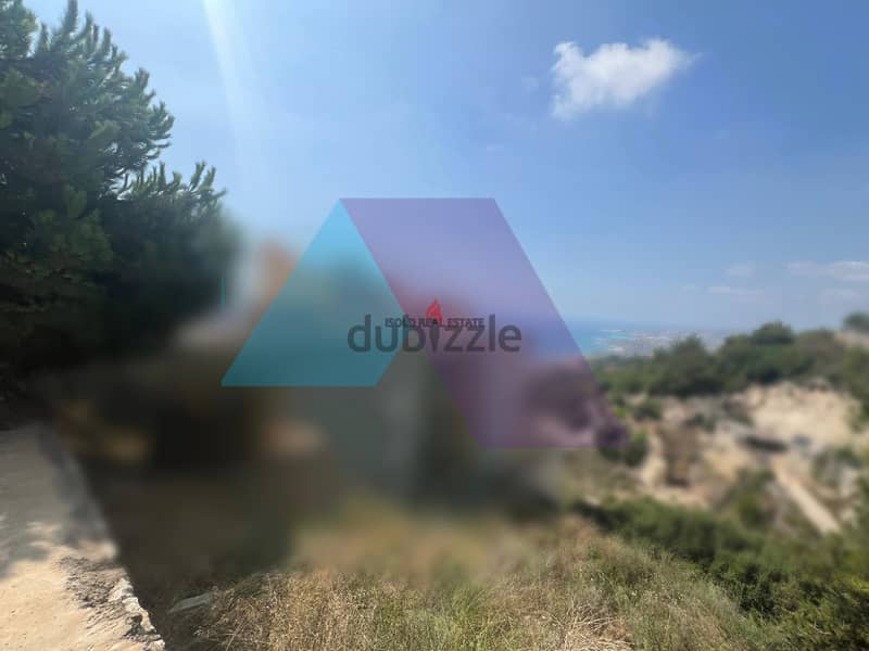 A 918 m2 land having an open mountain/sea view for sale in Halat 1