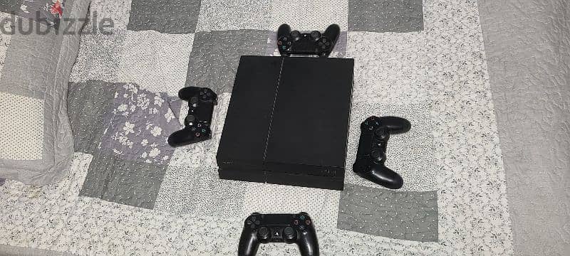 ps4 (fat) with 4 joysticks and fifa 24 0