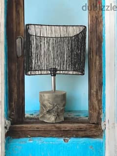 Concrete lamp base with steel wire shade