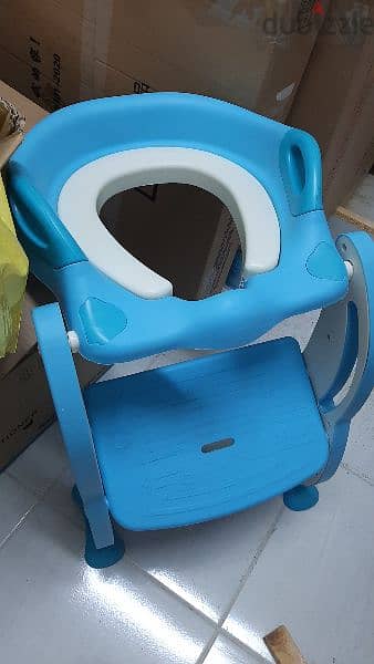 3 toilet baby seats, one of them with a leader 2