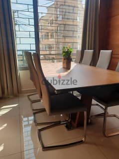 Dinning table with 8 leather chairs