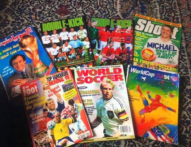 Arround 100 football and basketball magazines with a lot of posters 8