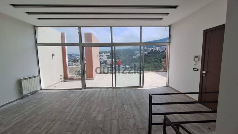 Duplex apartment with terrace and open views in Fanar. 1