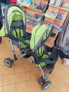 عرباية توأم او لطفلين مع طاولتين اكل وبتتنيم وتتجلس twins stroller 0