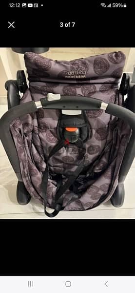 grey and black stroller 0