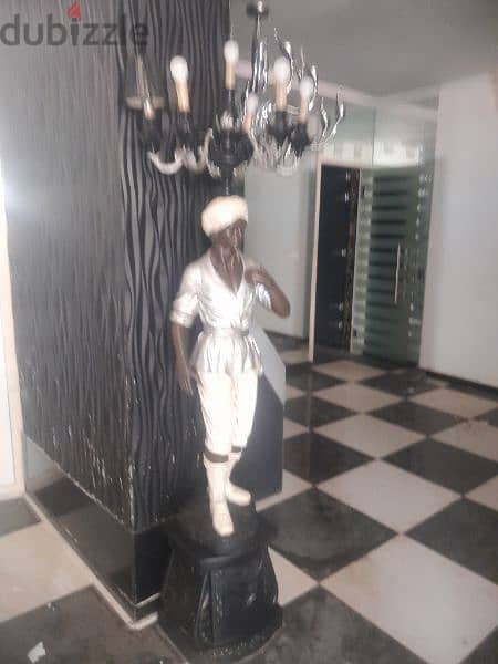 African statue chandelier 0