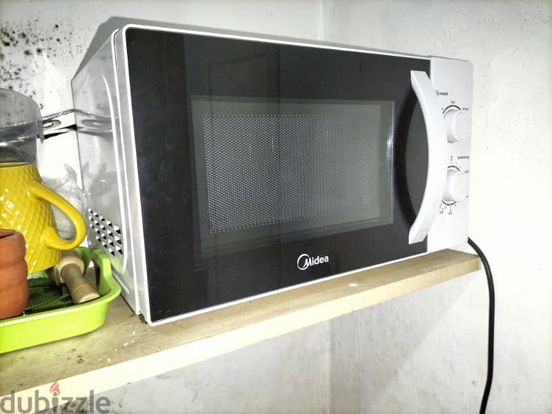 microwave oven midea like new 60$ v 0