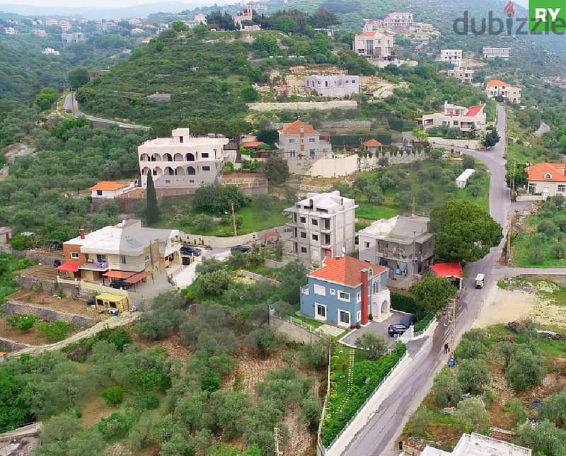 LAND ON THE MAIN ROAD IN GHALBOUN- JBEIL/غالبون  REF#RY110496 0