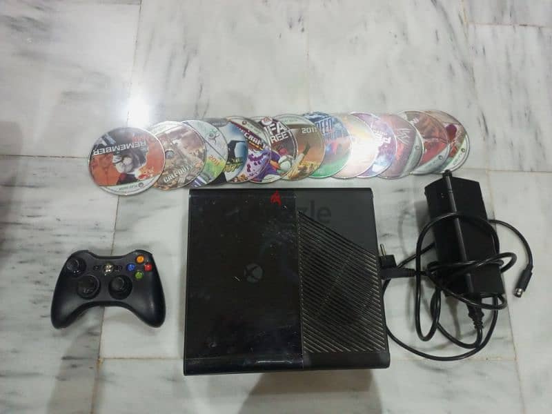 Xbox 360 with adopter and 13cd and one controler used 5 weeks 0