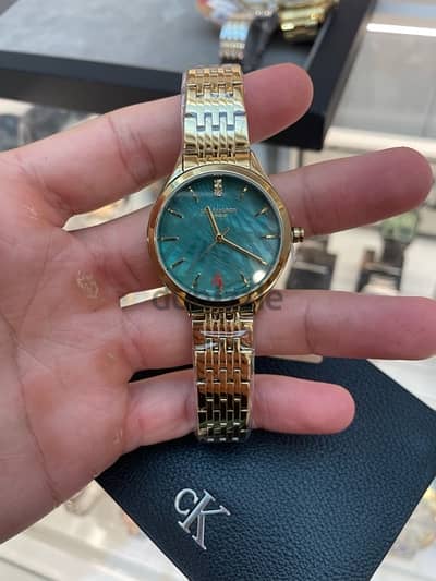 Lee Cooper London / Gold and green watch