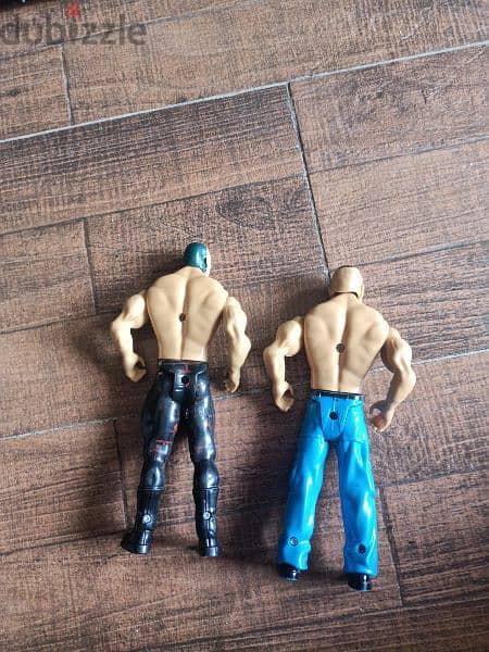 2 WWE action figures. 1