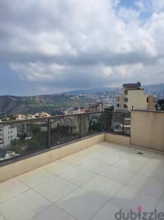 A rooftop apartment with open view for rent in Mazraat yachouh.