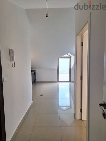 A rooftop apartment with open view for rent in Mazraat yachouh. 4