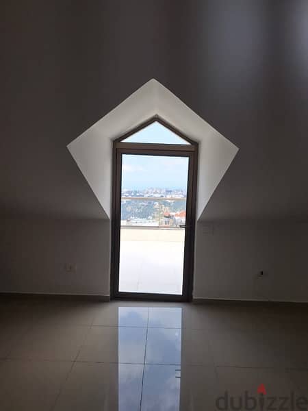 A rooftop apartment with open view for rent in Mazraat yachouh. 7