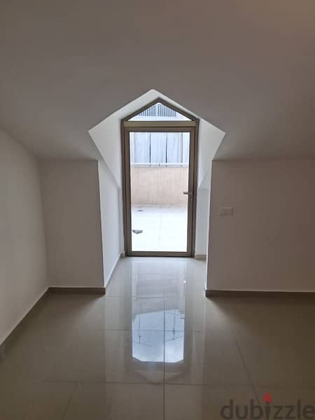 A rooftop apartment with open view for rent in Mazraat yachouh. 10