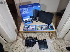 ps4 pro + 2 original controllers + 6 games + steering wheel