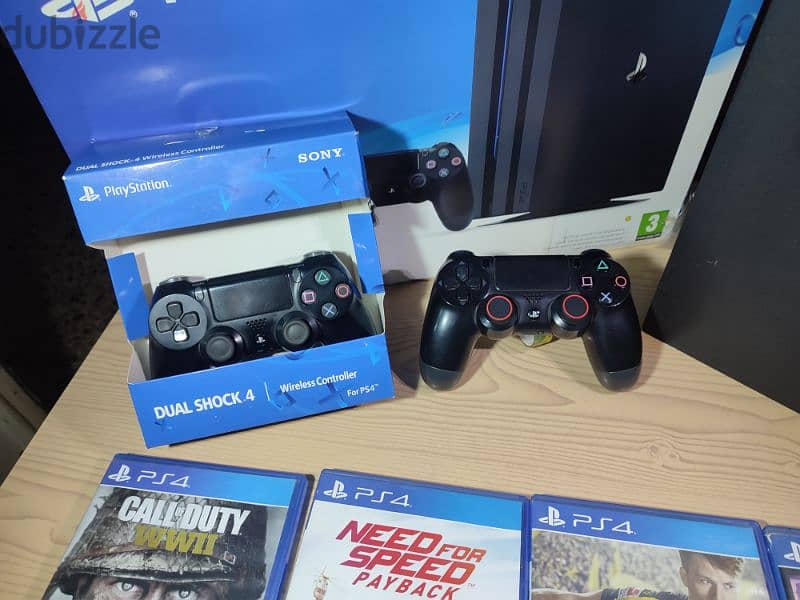 ps4 pro + 2 original controllers + 6 games + steering wheel 6