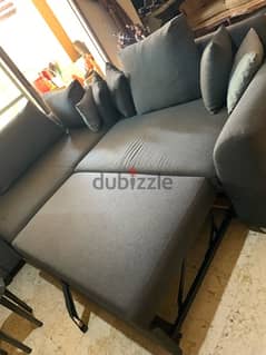 salon with tables and bed inside the sofa