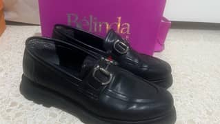 black leather loafers