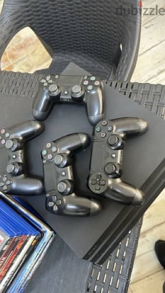 ps4 pro with 12 games + 4 original controllers 0