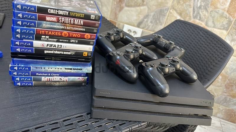 ps4 pro with 12 games + 4 original controllers 1