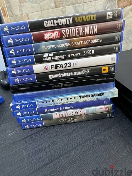 ps4 pro with 12 games + 4 original controllers 2