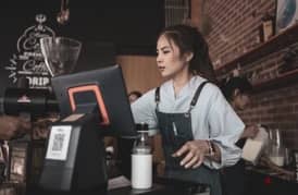 Female barista with cashier skills