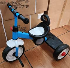 tricycle metal  with music & light. age from 2-4 years. price 25$