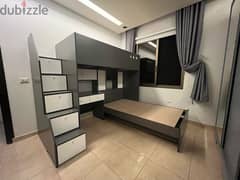 2 beds with drawers and desk