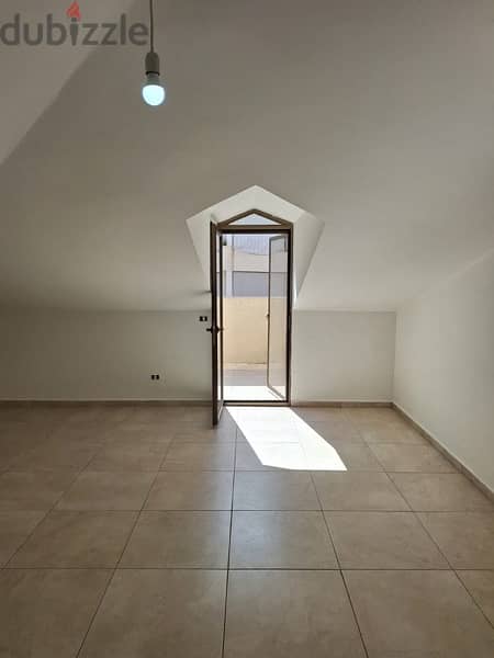 A rooftop apartment with open view for rent in Mazraat yachouh. 4