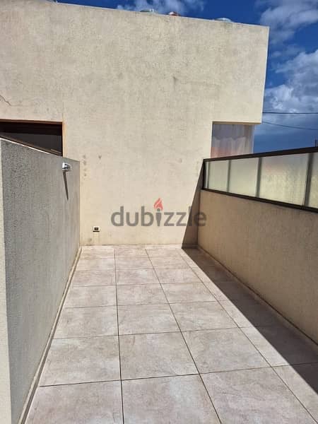 A rooftop apartment with open view for rent in Mazraat yachouh. 5