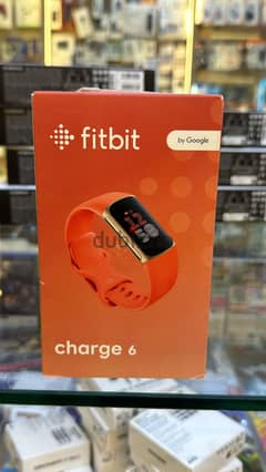 Fitbit Charge 6 champagne gold case coral band great & new offer 0