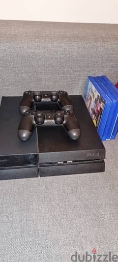 1tb ps4 fat with 2 controllers and 4 discs