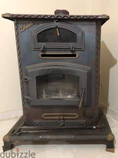 Wood stove with oven and electric fan very good condition 0