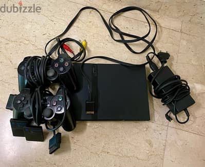 PS2 slim, 2 memory cards and 2 controlers, 21 games