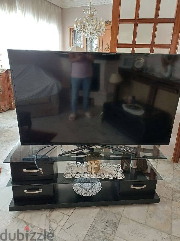 TV 57 inch with stand table 1