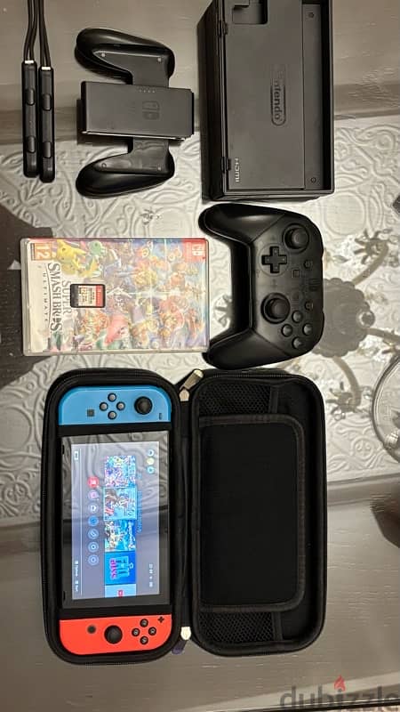 Nintendo switch used like new + games and accessories 0