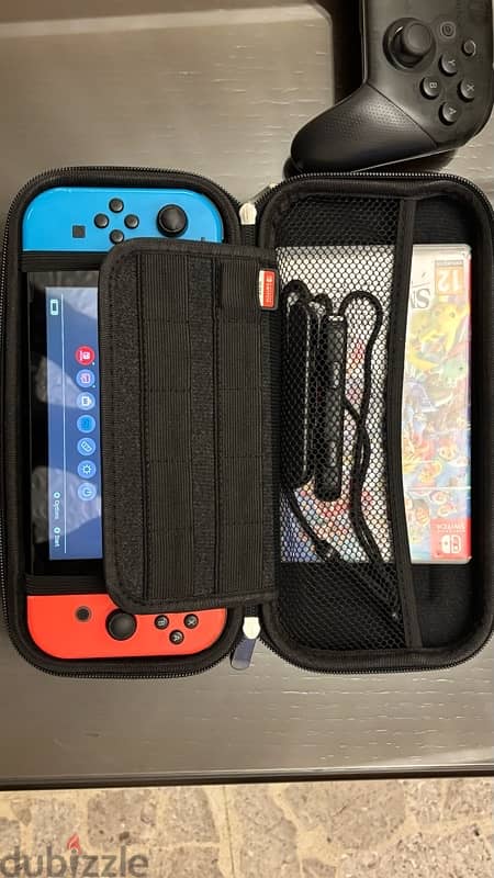 Nintendo switch used like new + games and accessories 4