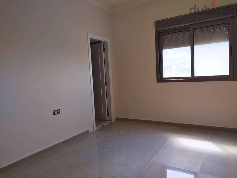 L16241 - Spacious 3-Bedroom Apartment For Sale in Kfarhbeib 4