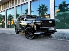 2022 Escalade 600 Sport in sleek black with a luxurious brown interior 0