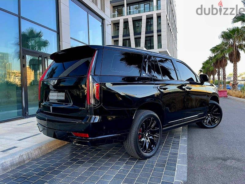 2022 Escalade 600 Sport in sleek black with a luxurious brown interior 1